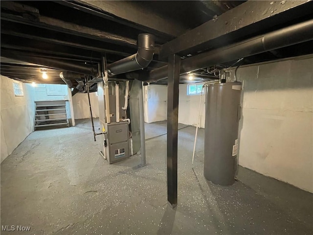 124 W 29th St, Lorain, OH 44055 - below grade area with electric water heater, stairway, and heating unit