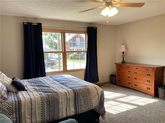 454 Lincoln Ave NW, Carrollton, OH 44615 - bedroom with light carpet, ceiling fan, and a textured ceiling