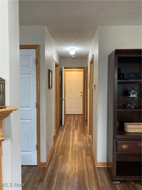 454 Lincoln Ave NW, Carrollton, OH 44615 - corridor with a textured ceiling and dark wood-type flooring