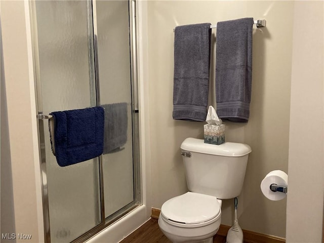 454 Lincoln Ave NW, Carrollton, OH 44615 - bathroom featuring a shower stall and wood finished floors