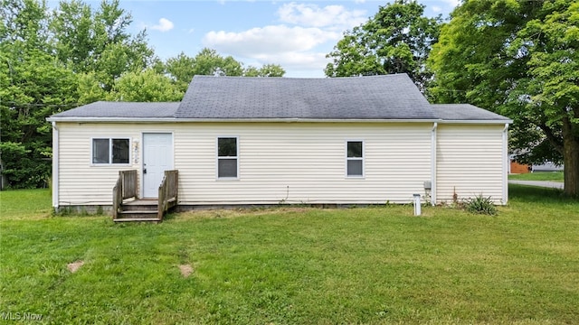 2914 Maple St, Norton, OH 44203 - back of property with a lawn and a shingled roof
