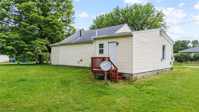 2914 Maple St, Norton, OH 44203 - rear view of house with a yard and a shingled roof