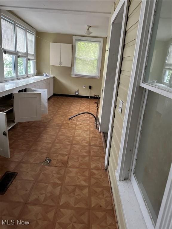 153 River St, Grantsville, WV 26147 - kitchen with white cabinets, healthy amount of natural light, and light countertops