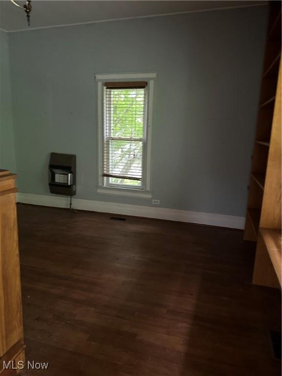 153 River St, Grantsville, WV 26147 - unfurnished living room with dark wood-style flooring and heating unit