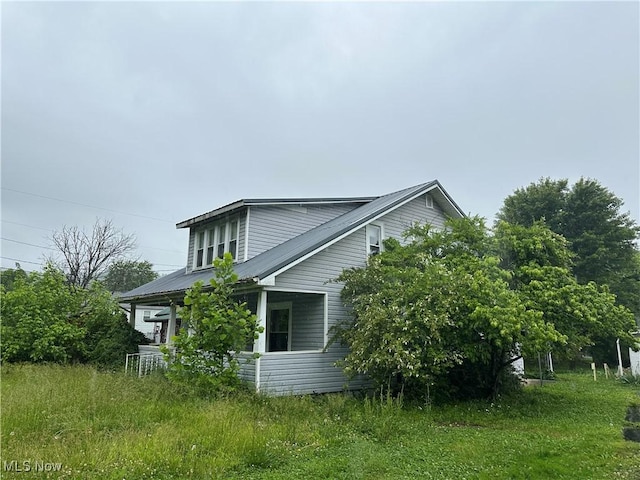 153 River St, Grantsville, WV 26147 - view of side of home with a metal roof