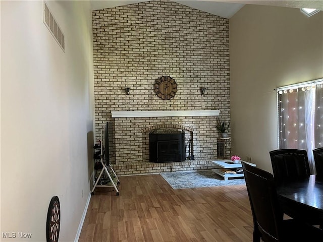199 Kanawha Rd, Weirton, WV 26062 - living area featuring lofted ceiling, a fireplace, and wood finished floors