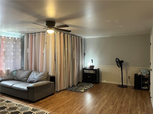 199 Kanawha Rd, Weirton, WV 26062 - living room with wood finished floors, a ceiling fan, and a wainscoted wall