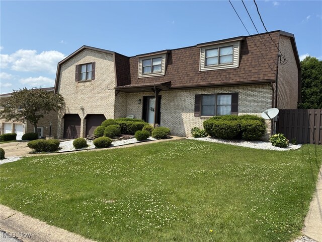 199 Kanawha Rd, Weirton, WV 26062 - view of front of home with brick siding, an attached garage, and roof with shingles