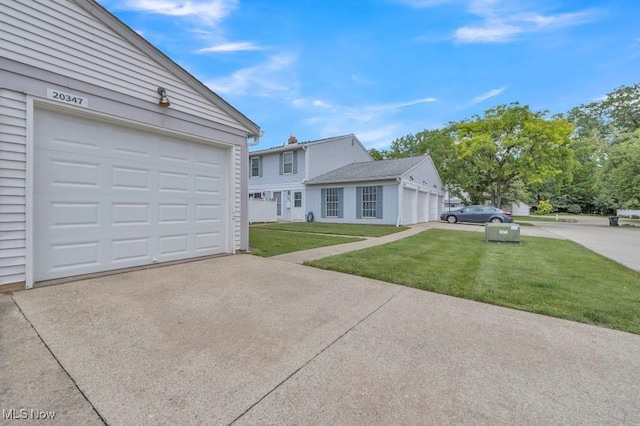 20347 Williamsburg Ct Unit 225B, Middleburg Heights, OH 44130 - view of front of home with driveway, a garage, and a front lawn