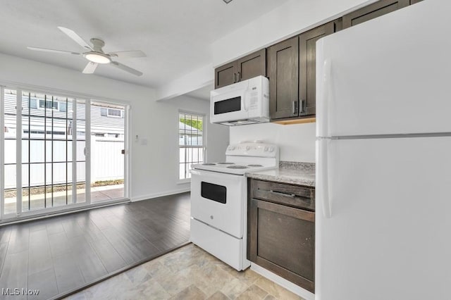 20347 Williamsburg Ct Unit 225B, Middleburg Heights, OH 44130 - kitchen featuring white appliances, dark brown cabinets, light countertops, and ceiling fan