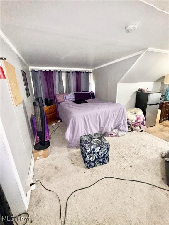 2320 22nd St SW, Akron, OH 44314 - bedroom with freestanding refrigerator, ornamental molding, and carpet