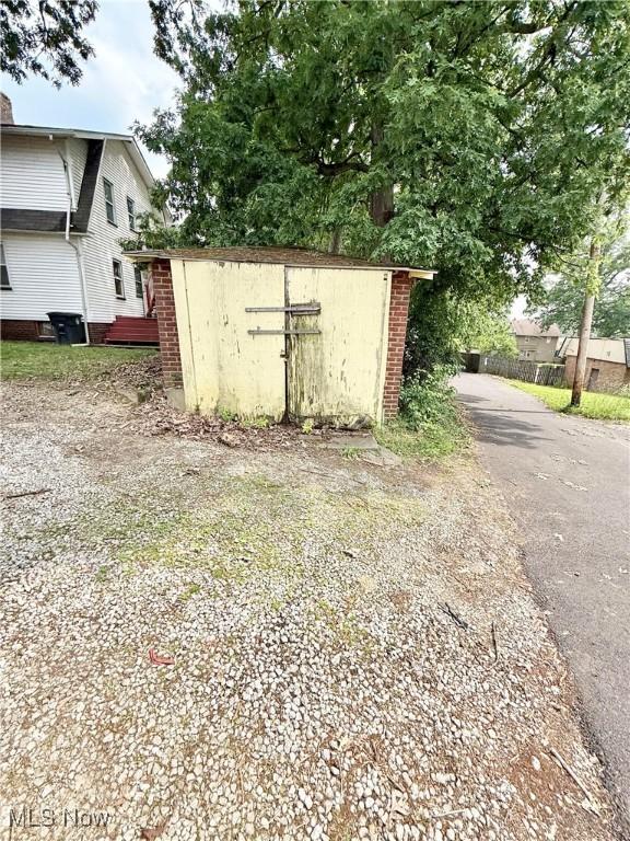 2320 22nd St SW, Akron, OH 44314 - view of shed featuring asphalt driveway