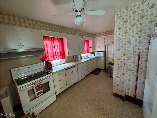 166 Bethesda St, Barnesville, OH 43713 - kitchen featuring white appliances, wallpapered walls, white cabinets, under cabinet range hood, and ceiling fan