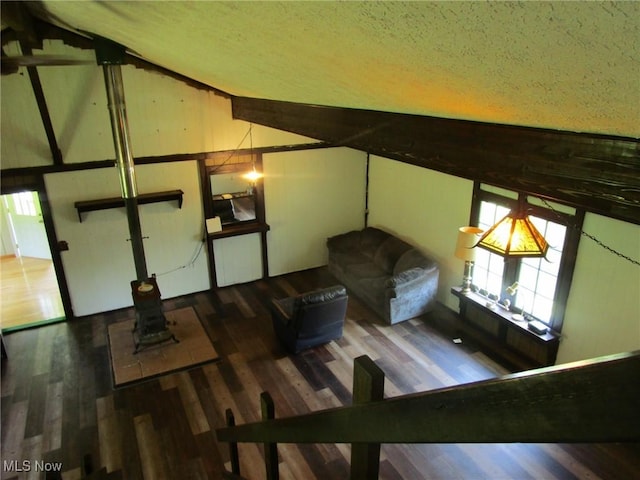 220 Daniels Ave, Conneaut, OH 44030 - living area with wood finished floors, a textured ceiling, and lofted ceiling
