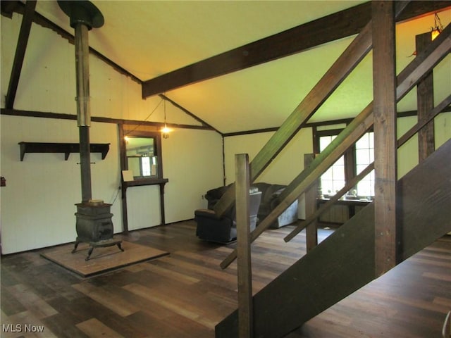220 Daniels Ave, Conneaut, OH 44030 - staircase featuring a wood stove, wood finished floors, and plenty of natural light