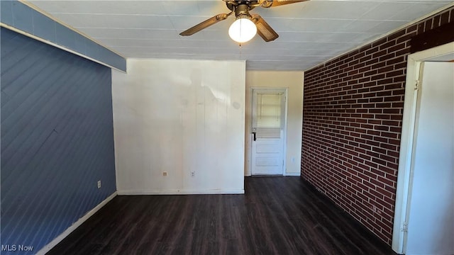 1014 20th St, Parkersburg, WV 26101 - spare room featuring wood finished floors, ceiling fan, and brick wall