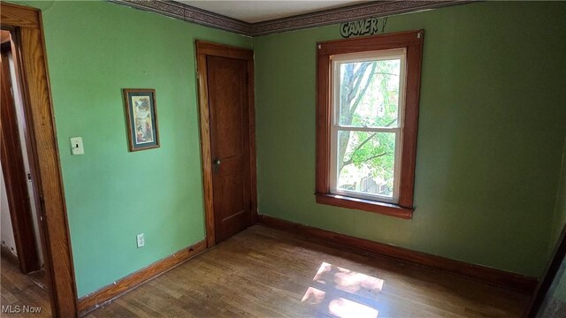 1014 20th St, Parkersburg, WV 26101 - empty room with plenty of natural light and wood finished floors