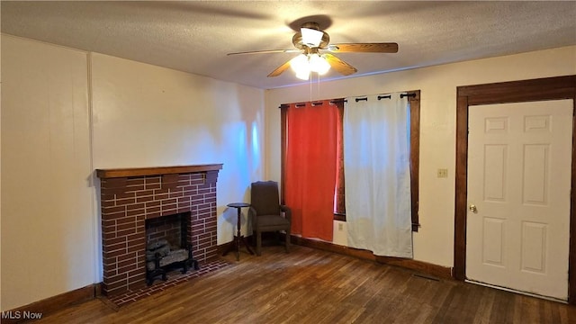 1014 20th St, Parkersburg, WV 26101 - living room with a ceiling fan, a tile fireplace, wood finished floors, and a textured ceiling