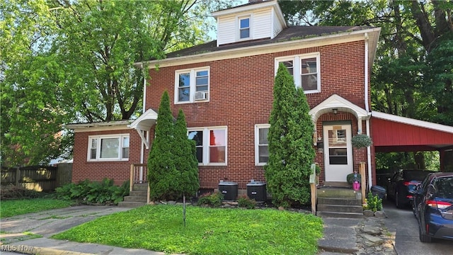 1014 20th St, Parkersburg, WV 26101 - traditional style home with brick siding and a carport