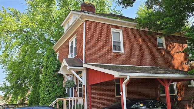 1014 20th St, Parkersburg, WV 26101 - view of side of property featuring brick siding and a chimney