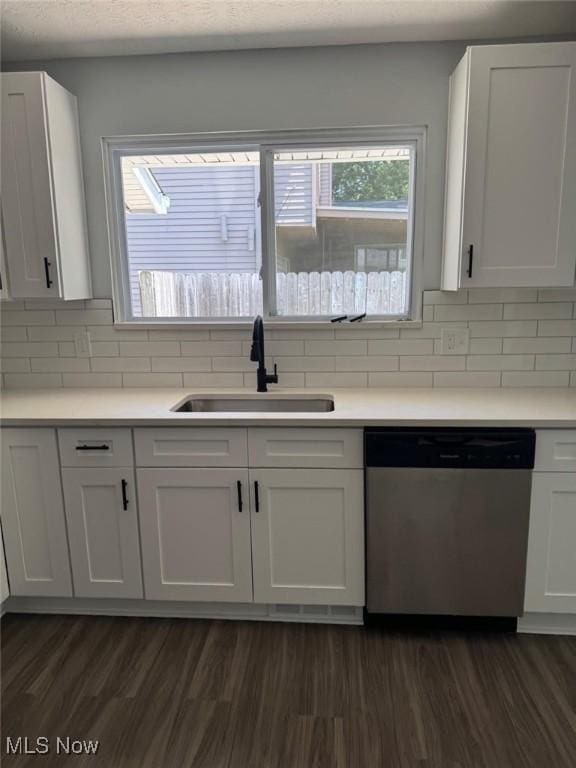 275 Butternut Ln, Berea, OH 44017 - kitchen with dishwasher, dark wood-type flooring, white cabinetry, tasteful backsplash, and healthy amount of natural light