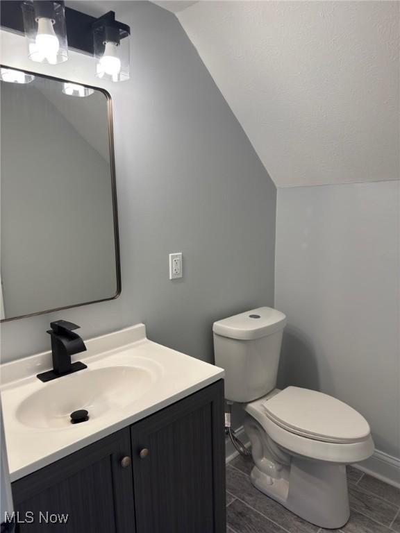 275 Butternut Ln, Berea, OH 44017 - bathroom with vaulted ceiling and vanity