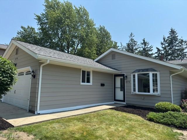 275 Butternut Ln, Berea, OH 44017 - ranch-style home with a garage, a front lawn, and roof with shingles