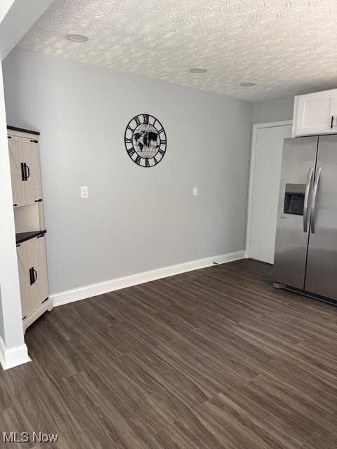 275 Butternut Ln, Berea, OH 44017 - unfurnished dining area with a textured ceiling and dark wood finished floors