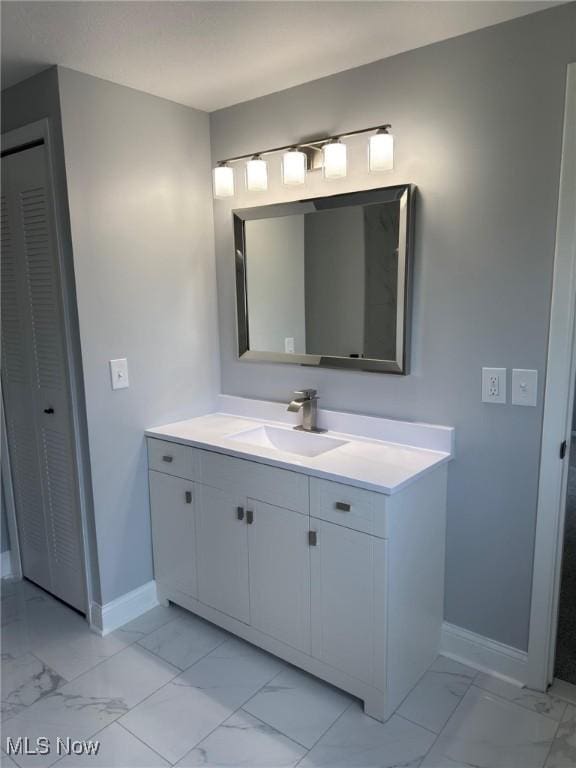 275 Butternut Ln, Berea, OH 44017 - bathroom with marble look tiles, vanity, and a closet