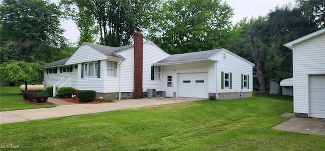 593 Furnace Rd, Conneaut, OH 44030 - view of side of home featuring a chimney, a garage, a lawn, driveway, and a shingled roof