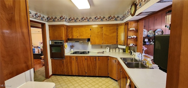 593 Furnace Rd, Conneaut, OH 44030 - kitchen featuring oven, under cabinet range hood, light floors, light countertops, and electric cooktop