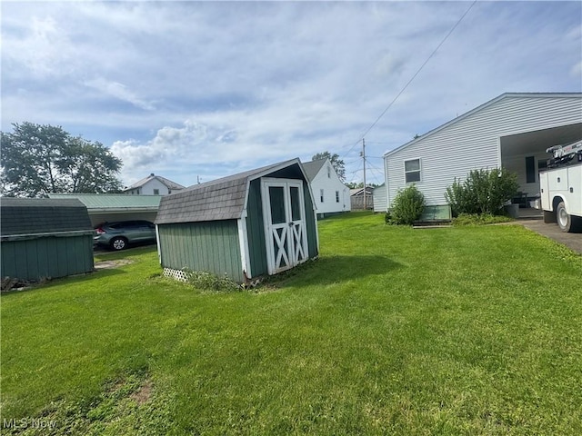 1015 Belford St, Caldwell, OH 43724 - view of green lawn with a shed and an attached carport