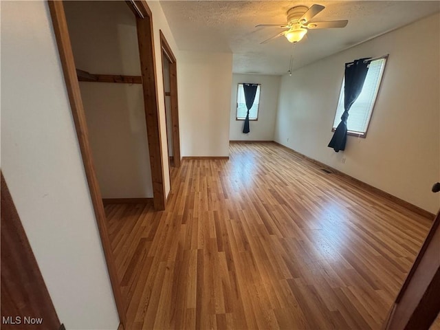 1015 Belford St, Caldwell, OH 43724 - unfurnished bedroom featuring light wood-type flooring and a ceiling fan