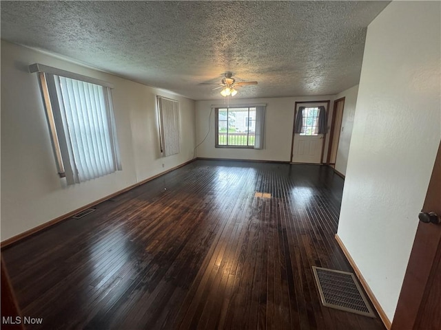 1015 Belford St, Caldwell, OH 43724 - empty room featuring a textured ceiling, wood-type flooring, and ceiling fan