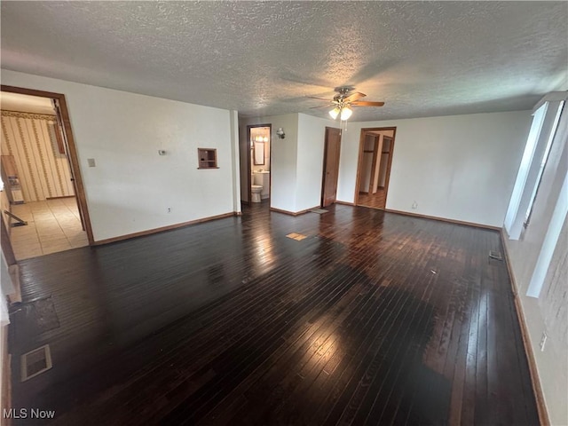 1015 Belford St, Caldwell, OH 43724 - unfurnished room with a ceiling fan, a textured ceiling, and hardwood / wood-style flooring