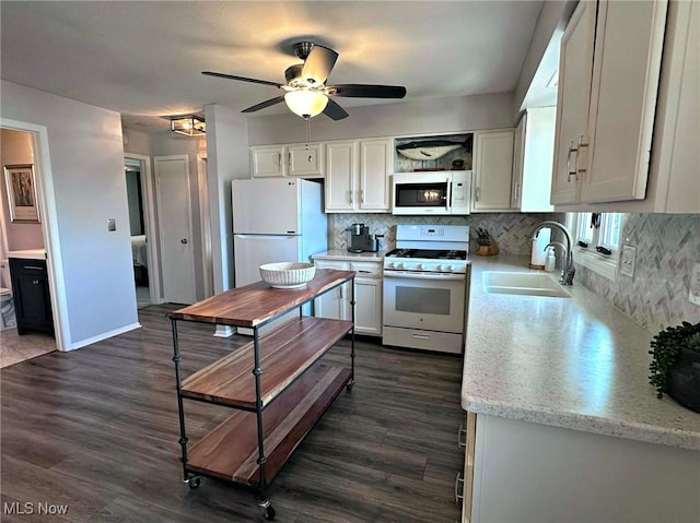 7374 Eisenhower Dr Unit 5, Boardman, OH 44512 - kitchen with white appliances, dark wood-style flooring, tasteful backsplash, a ceiling fan, and white cabinets
