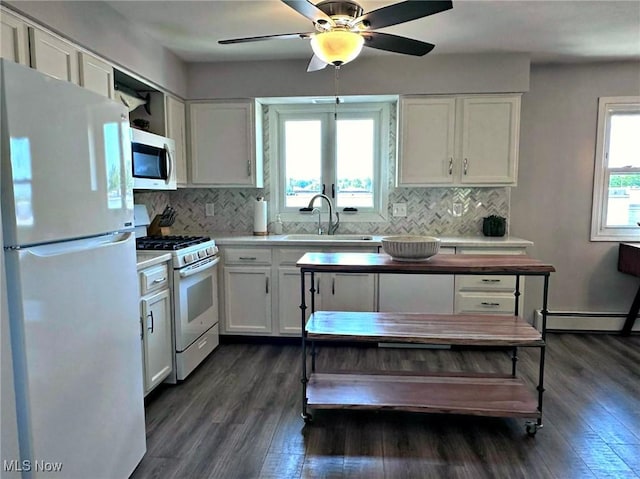 7374 Eisenhower Dr Unit 5, Boardman, OH 44512 - kitchen with white appliances, dark wood-style floors, white cabinets, and tasteful backsplash