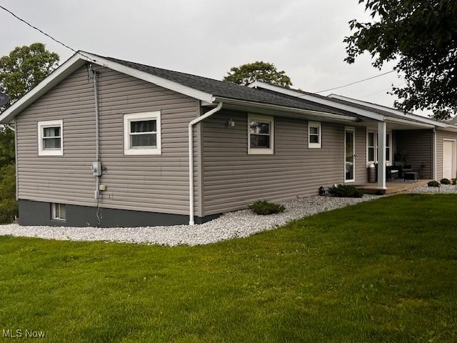 67682 Morristown Flushing Rd, Belmont, OH 43718 - view of side of property featuring a lawn