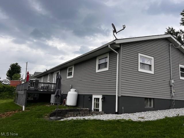 67682 Morristown Flushing Rd, Belmont, OH 43718 - back of house featuring a wooden deck and a lawn