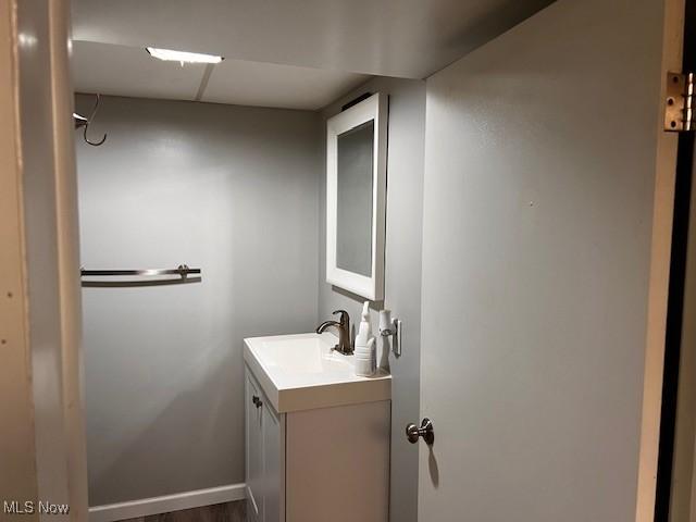 67682 Morristown Flushing Rd, Belmont, OH 43718 - bathroom featuring vanity and wood finished floors
