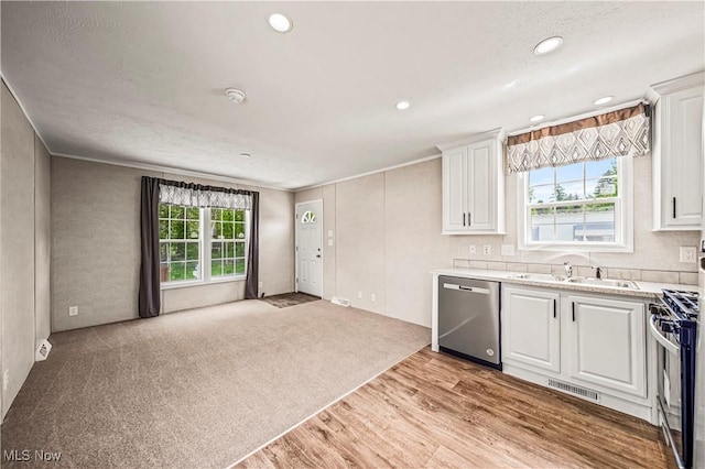 8323 Eagle Rd Unit 42, Kirtland, OH 44094 - kitchen with appliances with stainless steel finishes, light wood-style floors, white cabinetry, light countertops, and recessed lighting