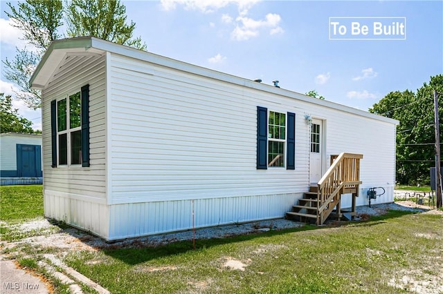 8323 Eagle Rd Unit 42, Kirtland, OH 44094 - view of side of home featuring a lawn