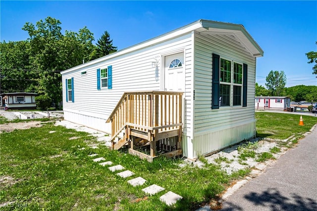 8323 Eagle Rd Unit 42, Kirtland, OH 44094 - view of front of property featuring a front yard