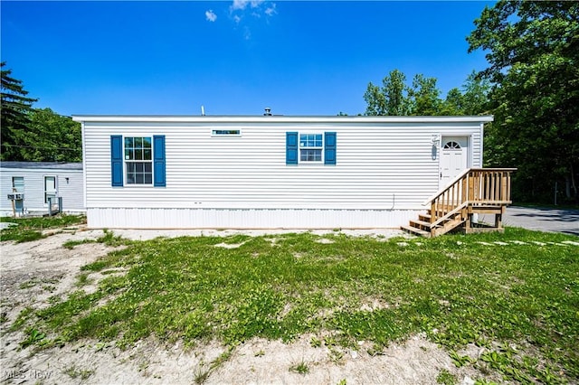 8323 Eagle Rd Unit 42, Kirtland, OH 44094 - rear view of property with a yard