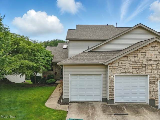 91 Falling Water Cir, Munroe Falls, OH 44262 - view of front of property with a shingled roof, stone siding, driveway, and a front lawn
