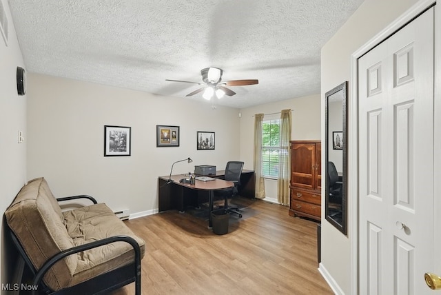 91 Falling Water Cir, Munroe Falls, OH 44262 - office space featuring a ceiling fan, light wood finished floors, a textured ceiling, and a baseboard heating unit