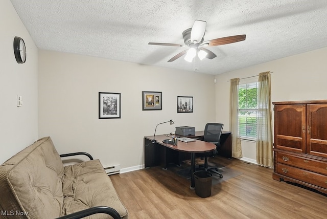 91 Falling Water Cir, Munroe Falls, OH 44262 - office area with light wood-type flooring, a ceiling fan, a textured ceiling, and a baseboard heating unit
