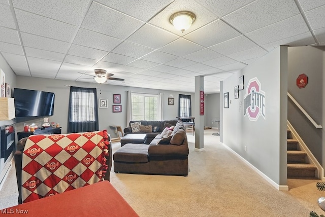 91 Falling Water Cir, Munroe Falls, OH 44262 - carpeted living room featuring stairs, a drop ceiling, and a ceiling fan