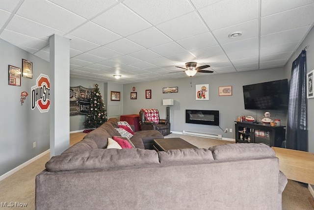91 Falling Water Cir, Munroe Falls, OH 44262 - carpeted living area with a paneled ceiling, a ceiling fan, and a baseboard radiator