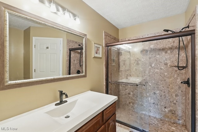 91 Falling Water Cir, Munroe Falls, OH 44262 - bathroom featuring a shower stall, vanity, and a textured ceiling